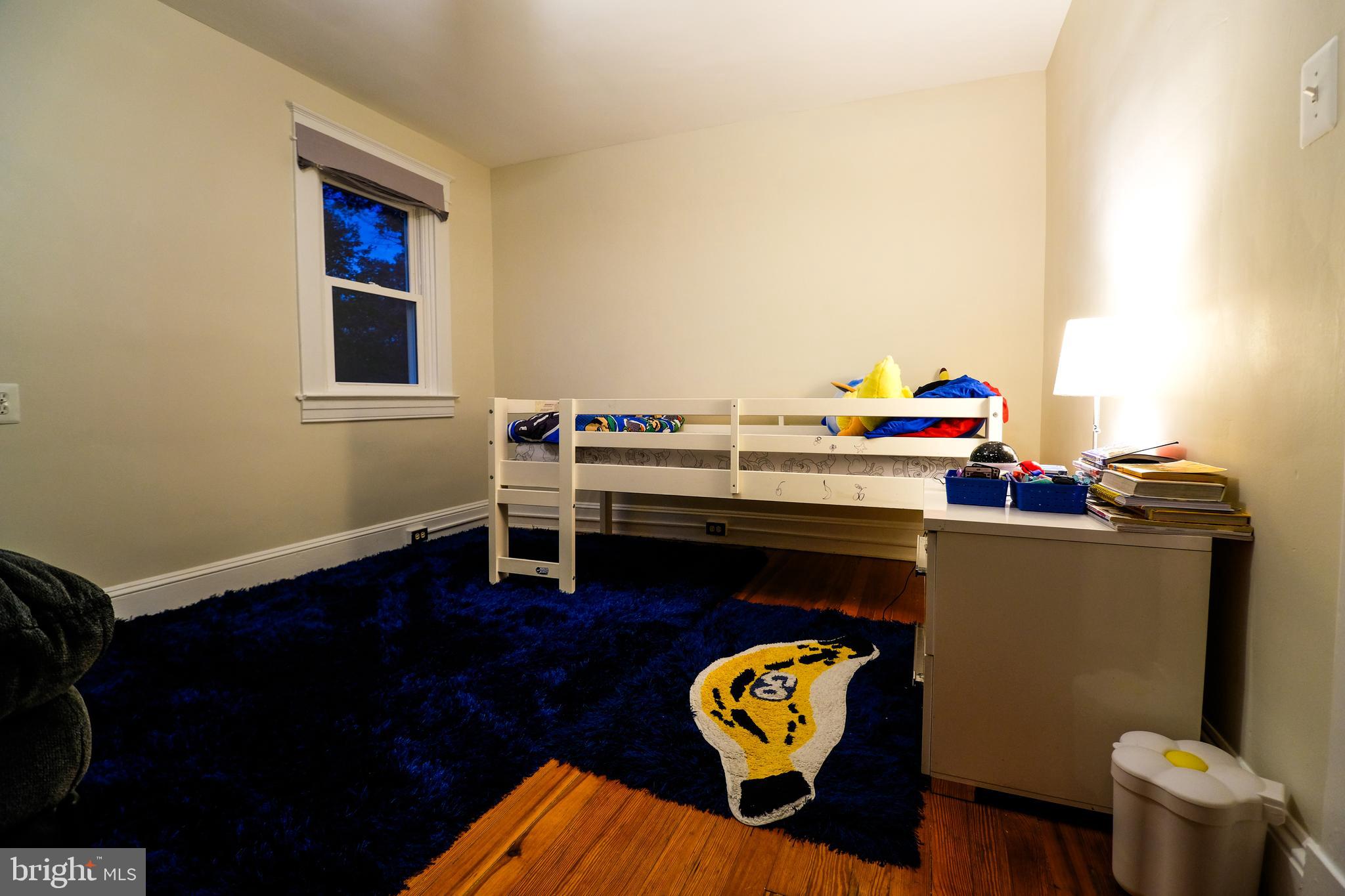 905 Woodsdale Road Catonsville, MD 21228 - Photo 10 of 23 a living room with furniture and a wooden floor