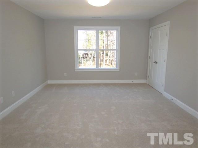 1628 Forest Road Wake Forest, NC 27587 - Photo 22 of 25 Large bonus room with closet, overhead light, cable prewire, carpet w/ 6lb pad
