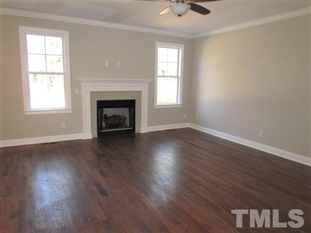 1628 Forest Road Wake Forest, NC 27587 - Photo 8 of 25 Open family room w/ site finished hardwoods, crown moulding, cable prewire, gas log fireplace
