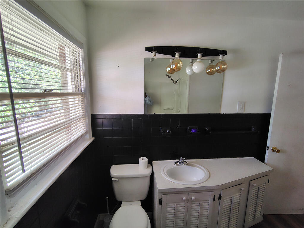 5031 Showalter Road Northwest Roanoke, VA 24017 - Photo 11 of 21 a bathroom with a toilet sink and mirror