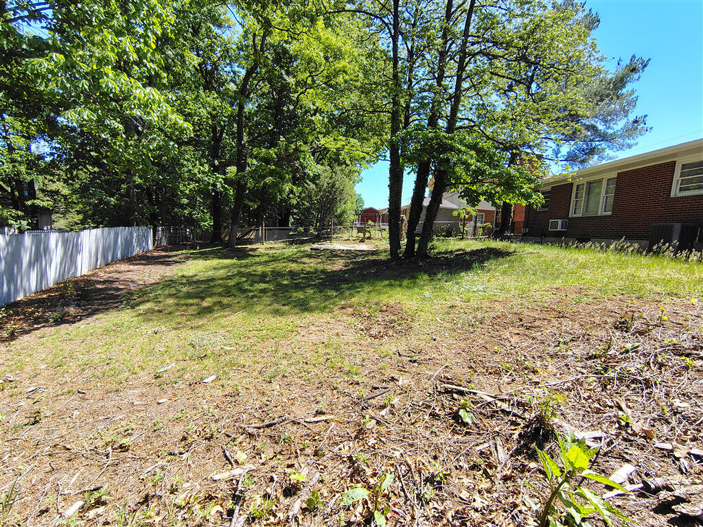 5031 Showalter Road Northwest Roanoke, VA 24017 - Photo 21 of 21 a view of a backyard with large trees and plants