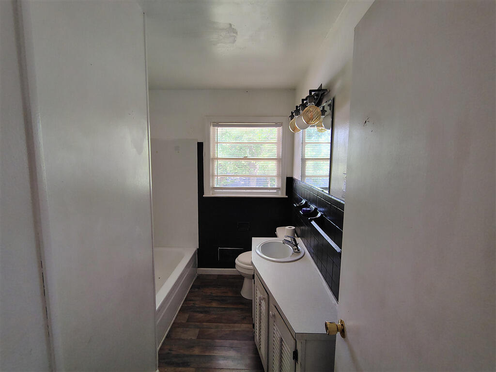 5031 Showalter Road Northwest Roanoke, VA 24017 - Photo 10 of 21 a bathroom with a sink a toilet and window