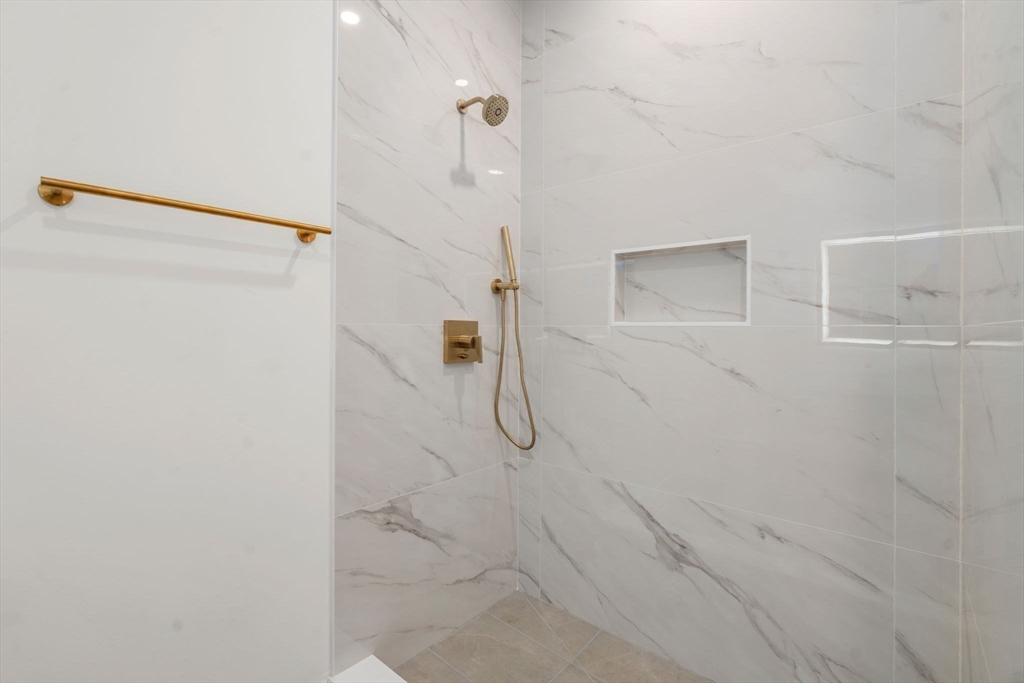 16 Stearns Road, Unit 304 Wellesley, MA 02482 - Photo 16 of 21 a bathroom with a shower