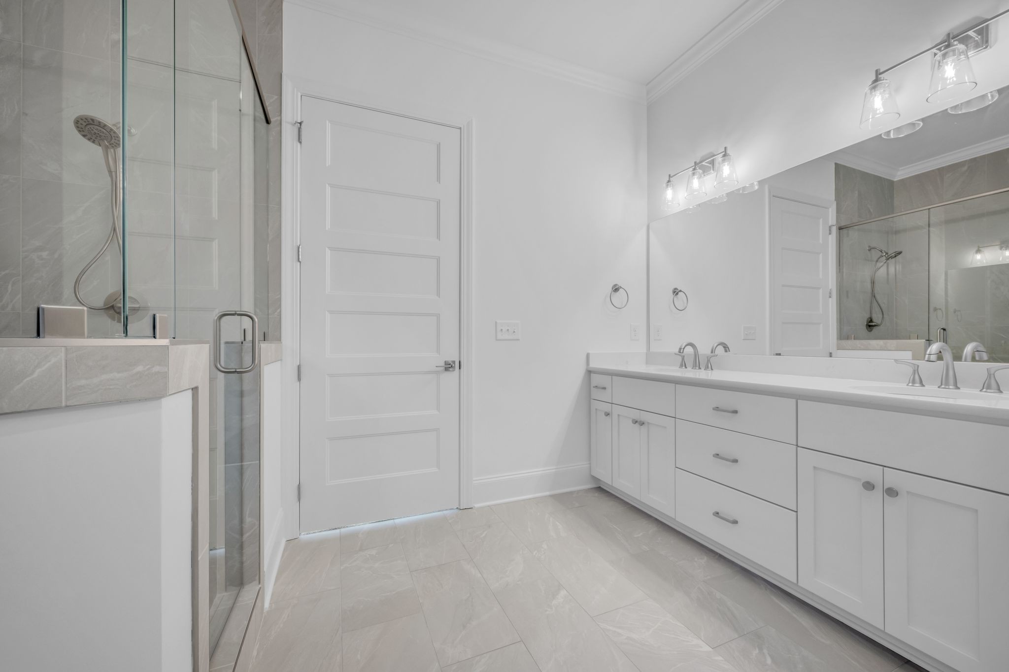 7137 Frances Street Fairview, TN 37062 - Photo 34 of 64 a bathroom with a double vanity sink a mirror and a bathtub