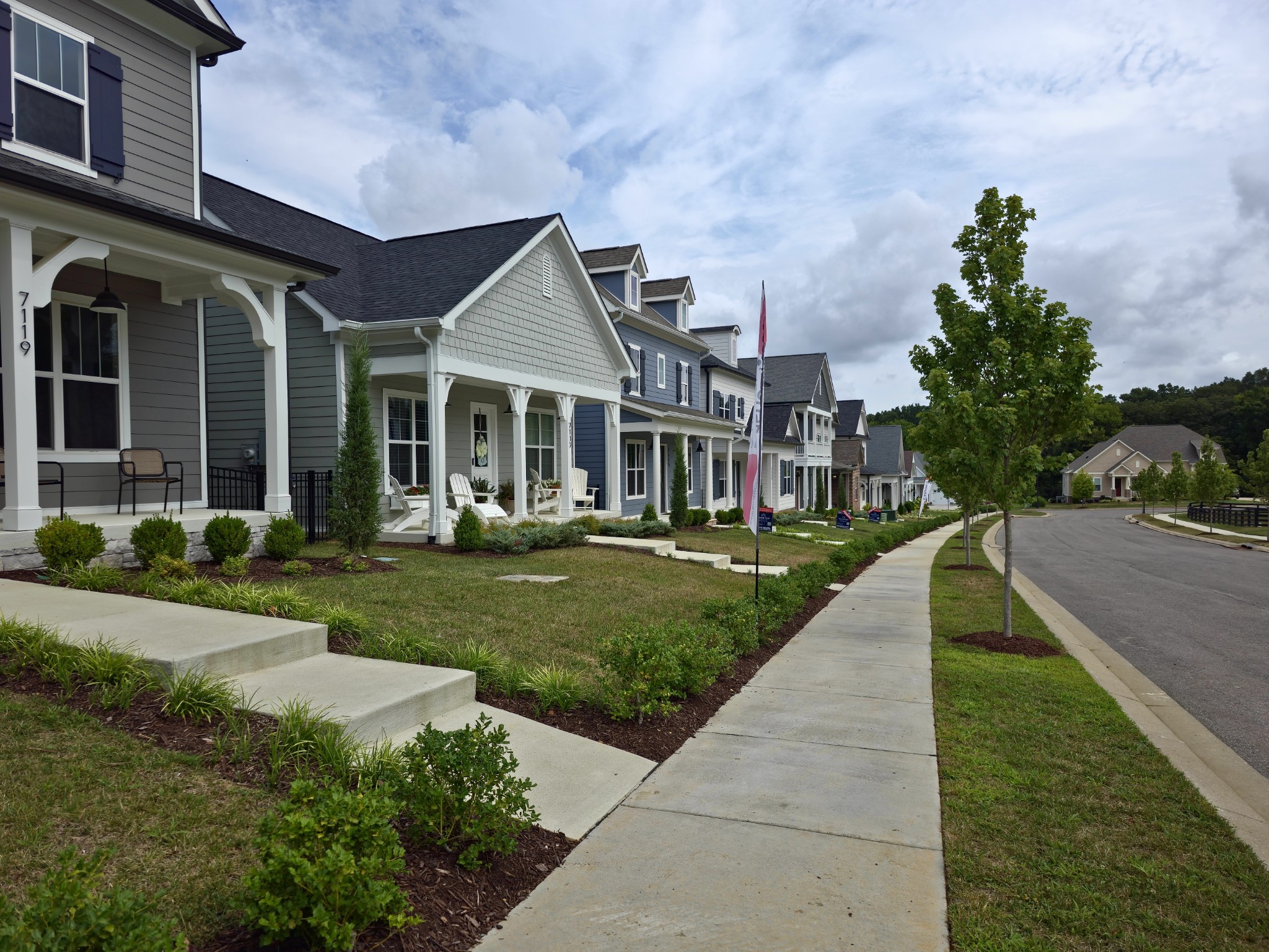 7137 Frances Street Fairview, TN 37062 - Photo 58 of 64 a front view of a house with a yard and potted plants