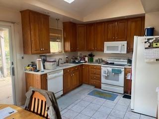 53 Miller Road Mill Run, PA 15464 - Photo 12 of 18 a kitchen with a stove window and cabinets