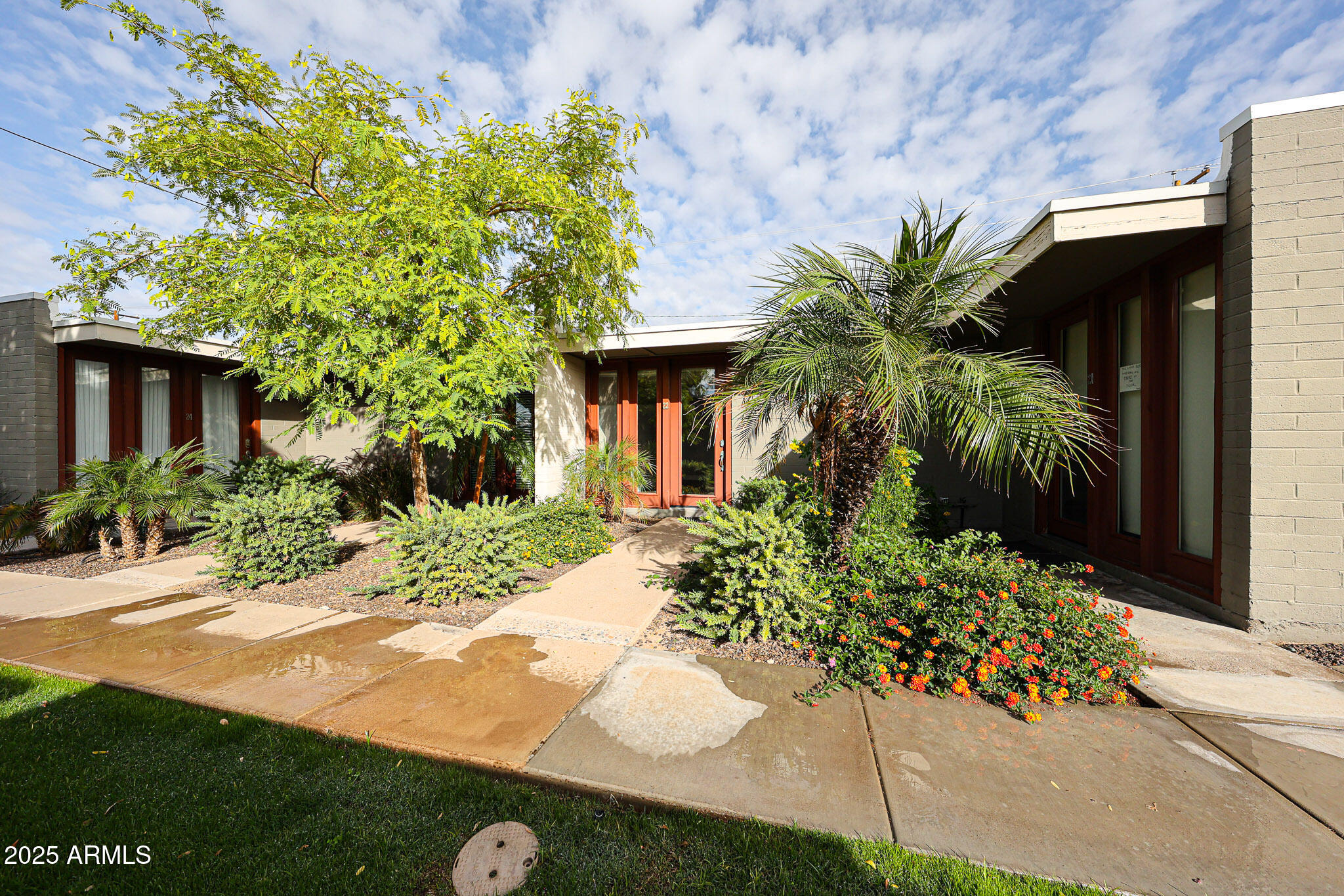 4419 North 27th Street, Unit 22 Phoenix, AZ 85016 - Photo 2 of 46 a front view of a house with a yard