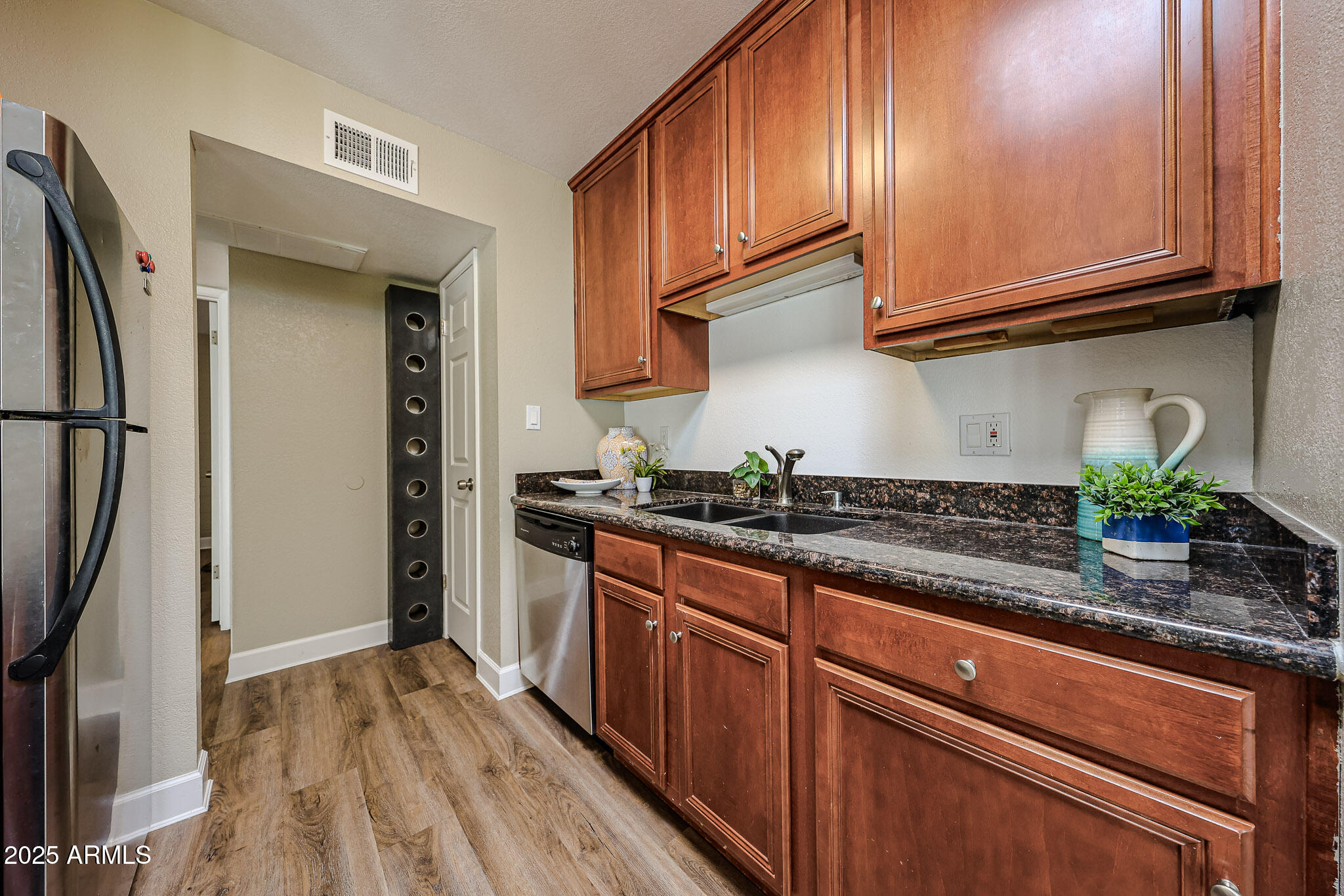4419 North 27th Street, Unit 22 Phoenix, AZ 85016 - Photo 6 of 46 a kitchen with stainless steel appliances granite countertop a refrigerator and a sink