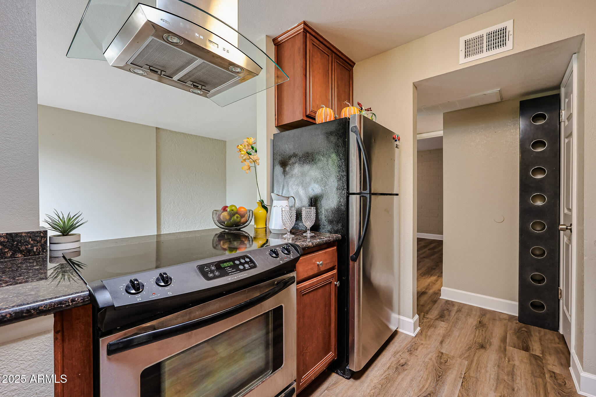 4419 North 27th Street, Unit 22 Phoenix, AZ 85016 - Photo 9 of 46 a kitchen with stainless steel appliances granite countertop a stove and a refrigerator