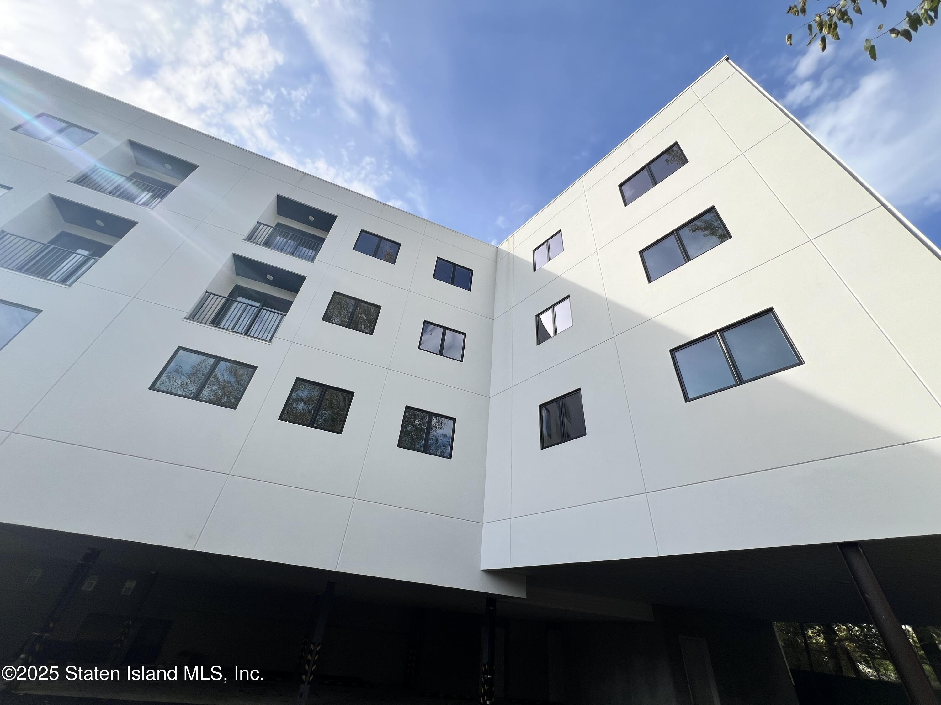 3865 Amboy Road, Unit 4A Staten Island, NY 10308 - Photo 15 of 18 a view of building with balcony