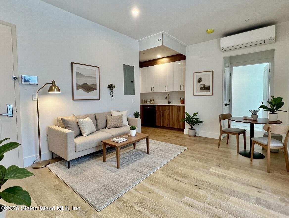 3865 Amboy Road, Unit 4A Staten Island, NY 10308 - Photo 2 of 18 a living room with furniture and a large window