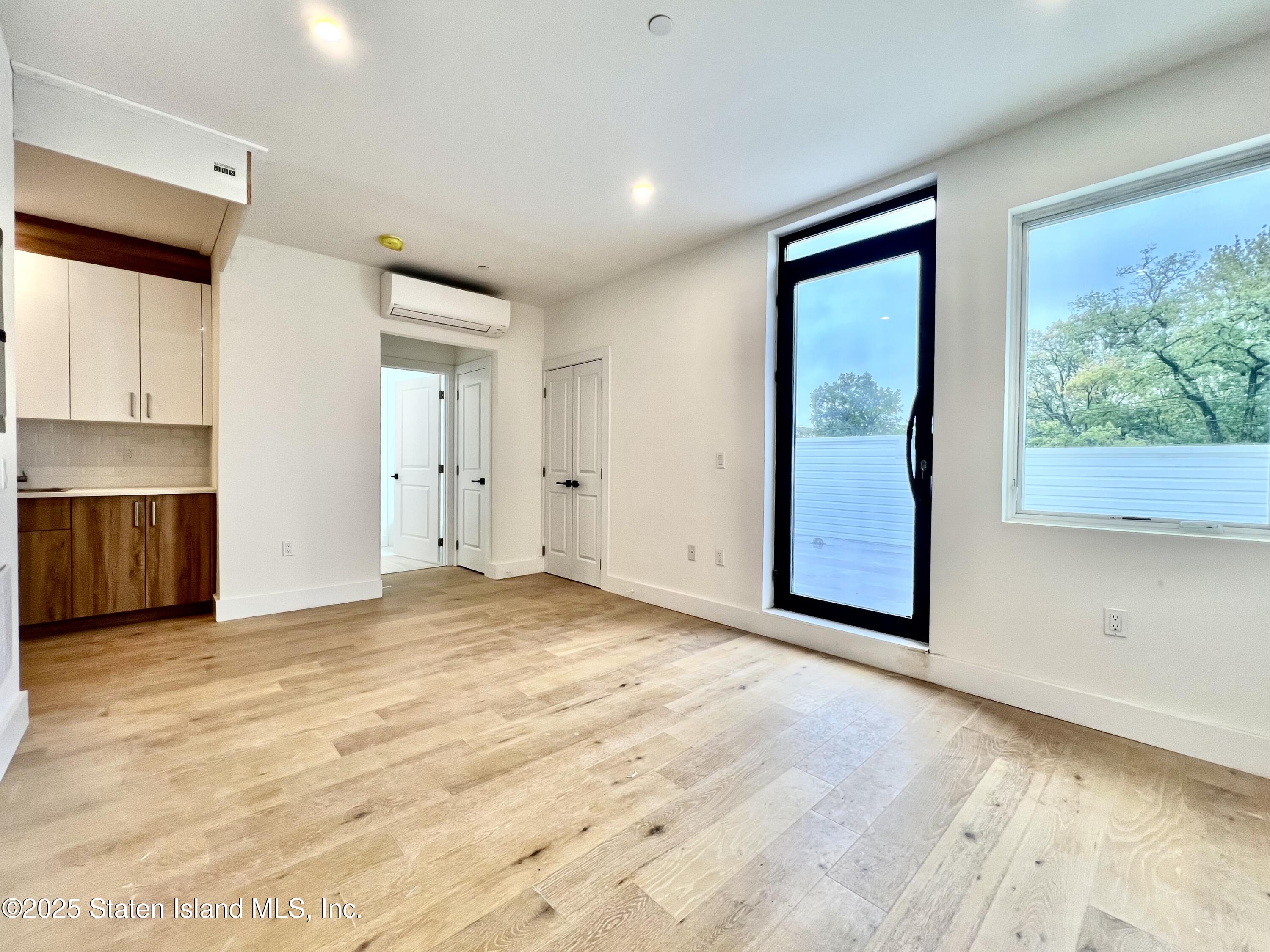 3865 Amboy Road, Unit 4A Staten Island, NY 10308 - Photo 5 of 18 a view of an empty room with a window