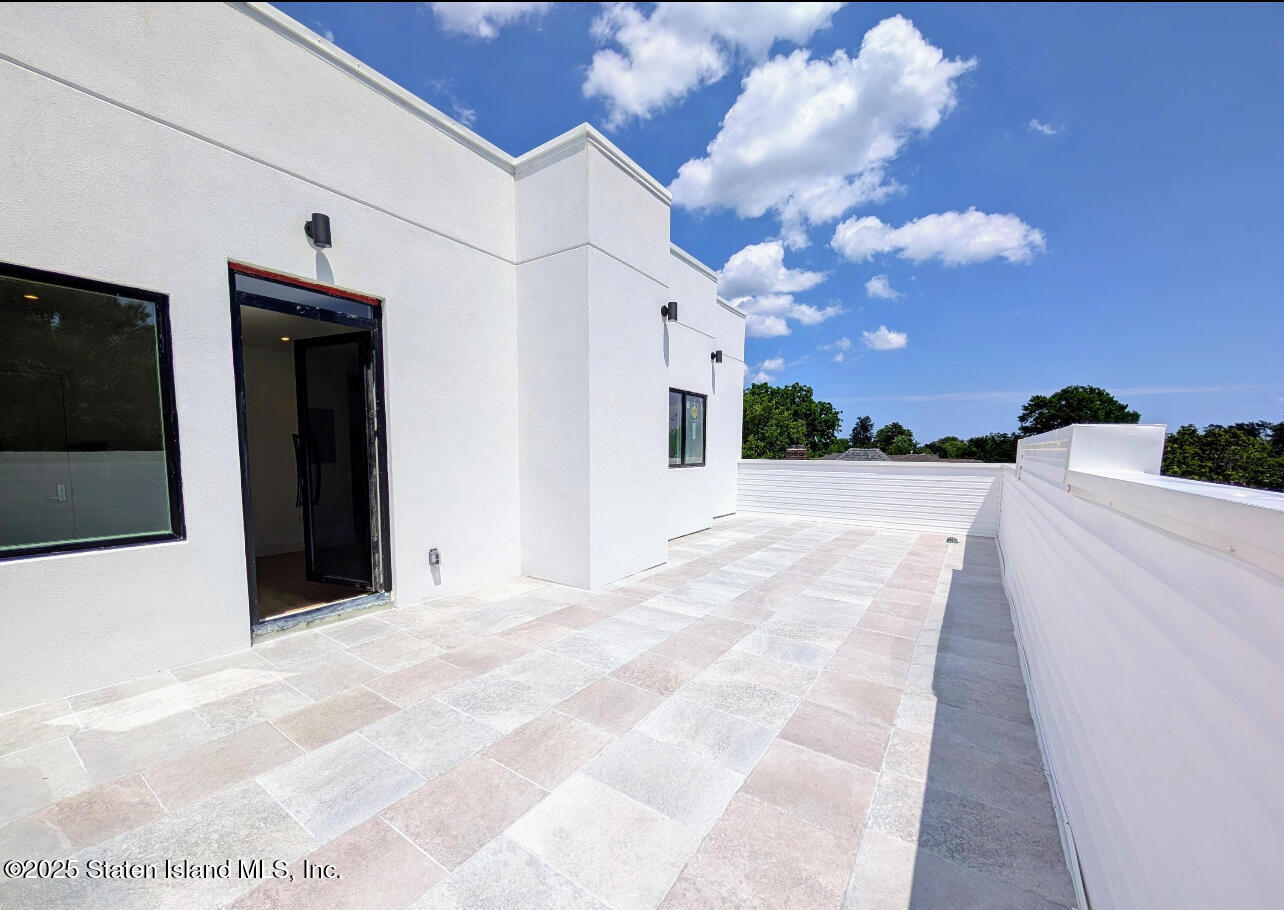 3865 Amboy Road, Unit 4A Staten Island, NY 10308 - Photo 10 of 18 a view of a street with a building in the background