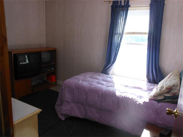 52 Pequot Point Road Westfield, MA 01085 - Photo 11 of 17 a bedroom with a bed and a window