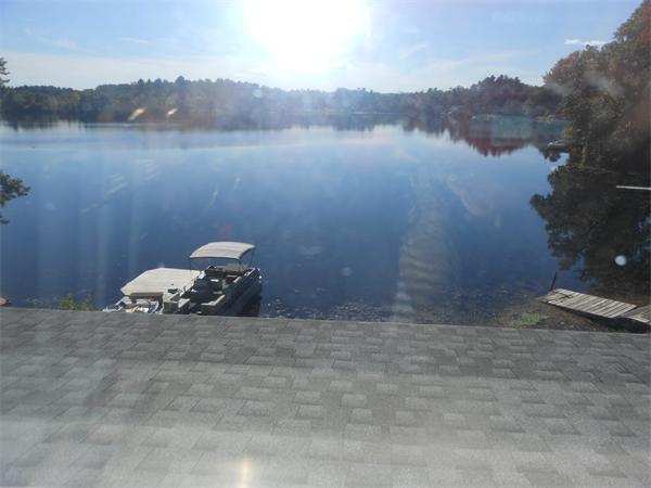 52 Pequot Point Road Westfield, MA 01085 - Photo 12 of 17 a view of a lake from a yard