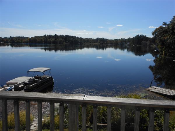 52 Pequot Point Road Westfield, MA 01085 - Photo 15 of 17 a view of a lake with a mountain in the background