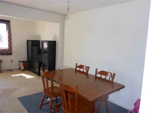 52 Pequot Point Road Westfield, MA 01085 - Photo 16 of 17 a view of a dining room with furniture and wooden floor