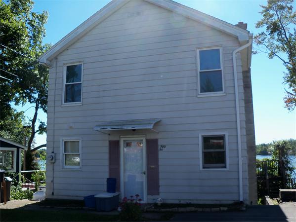 52 Pequot Point Road Westfield, MA 01085 - Photo 2 of 17 a brick house with a large windows