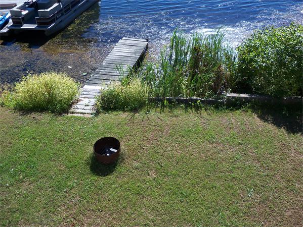 52 Pequot Point Road Westfield, MA 01085 - Photo 5 of 17 a view of a lake with a yard