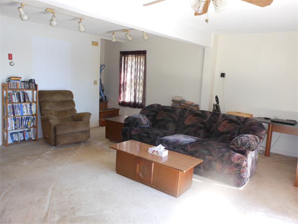 52 Pequot Point Road Westfield, MA 01085 - Photo 8 of 17 a living room with furniture cabinets and a window