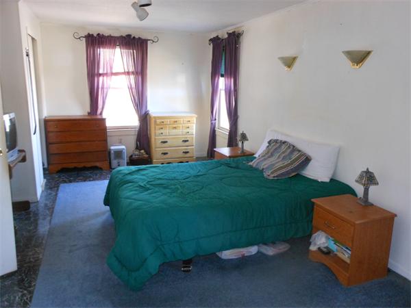 52 Pequot Point Road Westfield, MA 01085 - Photo 9 of 17 a bedroom with a bed and a window