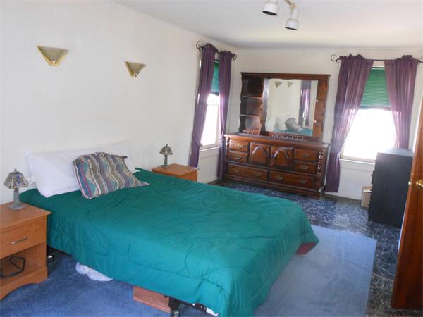 52 Pequot Point Road Westfield, MA 01085 - Photo 10 of 17 a bedroom with a bed and window