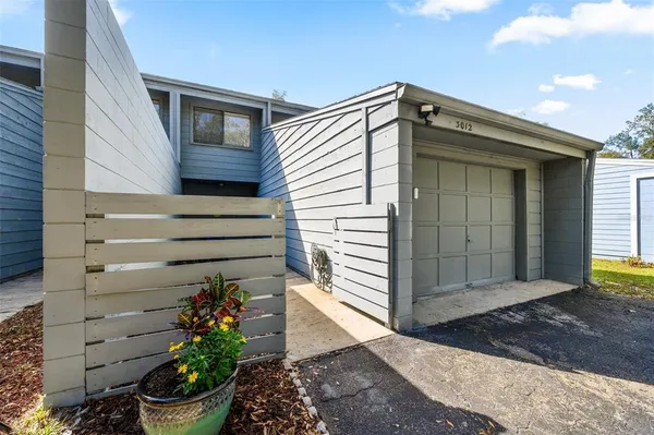 a view of entryway with flower pots