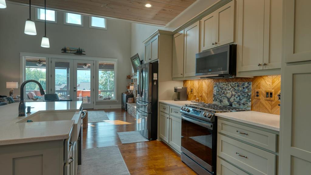 31 Elf School Road Hayesville, NC 28904 - Photo 30 of 59 a kitchen with granite countertop a stove and a microwave