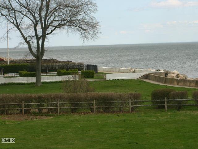 60 Saddle Rock Road Stamford, CT 06902 - Photo 1 of 1 a view of a golf course with a lake
