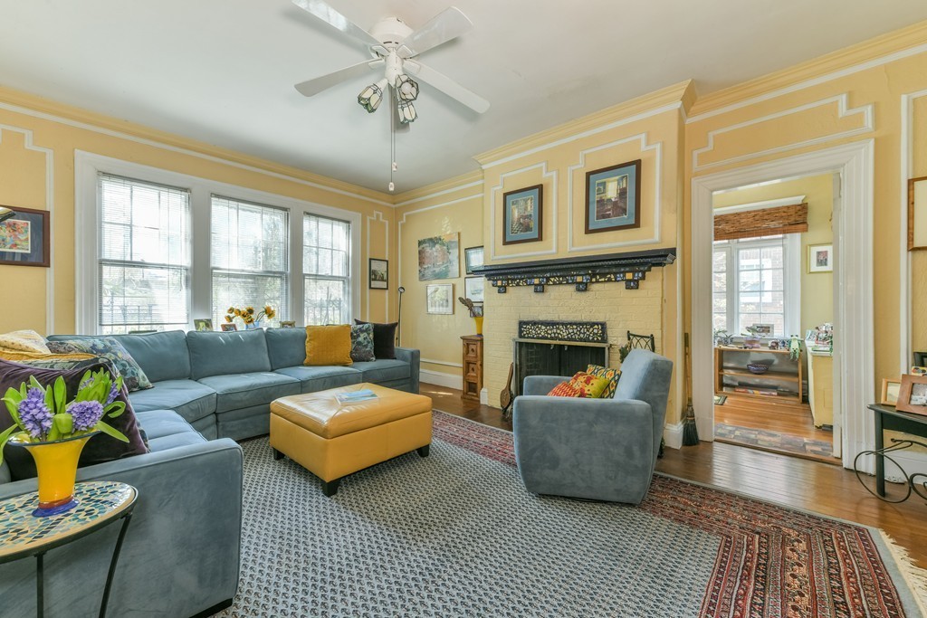 114 Addington Road, Unit 1 Brookline, MA 02445 - Photo 3 of 15 a living room with furniture and a fireplace