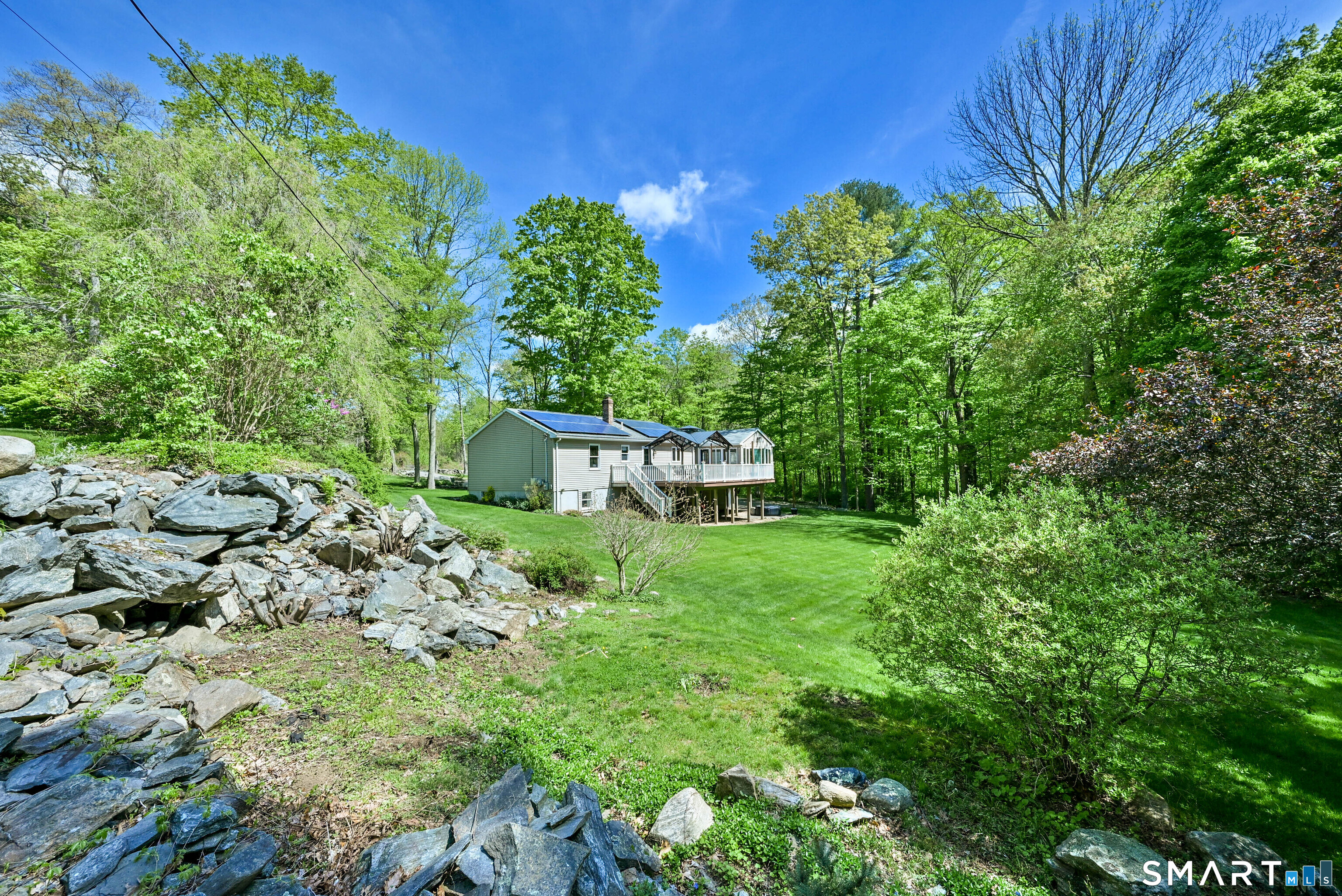 309 O'Leary Road Thompson, CT 06277 - Photo 1 of 40 a view of a garden with a fountain