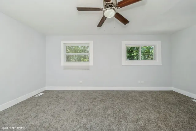 an empty room with fan