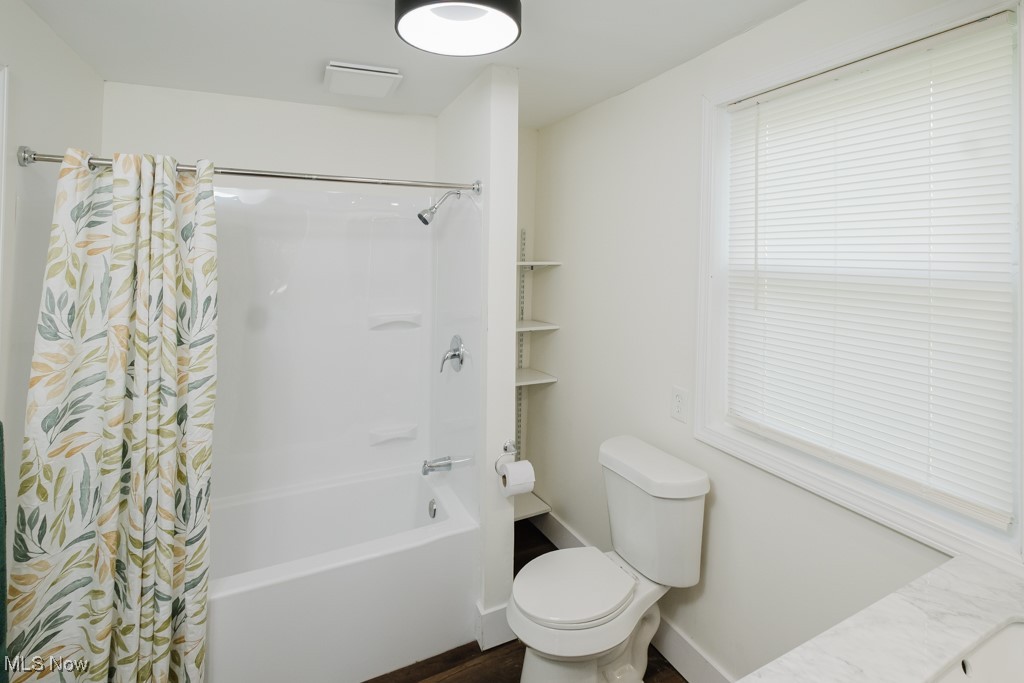 8150 Madison Road Thompson, OH 44086 - Photo 16 of 28 Full bathroom featuring shower / bath combination with curtain and toilet