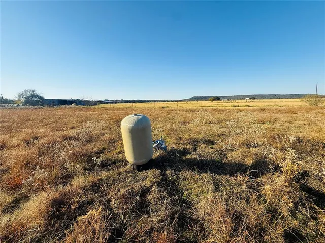 a view of a lake from a yard