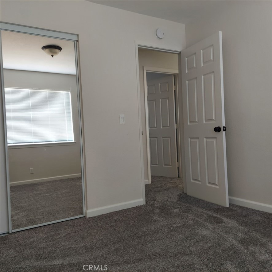 12754 Redwing Road Apple Valley, CA 92308 - Photo 9 of 9 an empty room with closet area