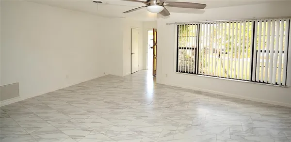 a view of an empty room with a window