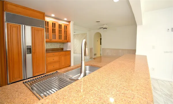 a view of a kitchen cabinets and a counter top space