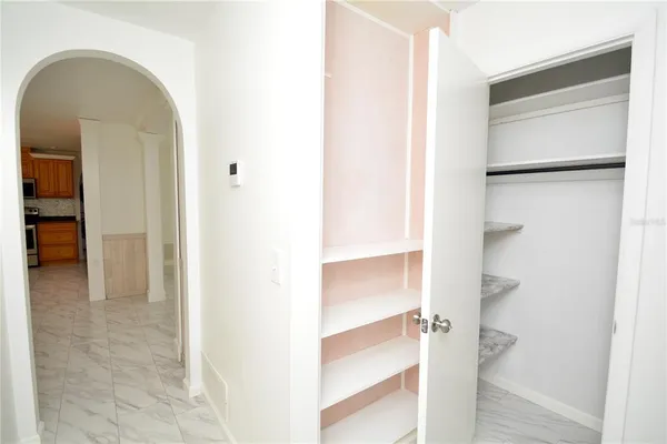 a kitchen with stainless steel appliances granite countertop a stove top oven a sink a counter space and cabinets