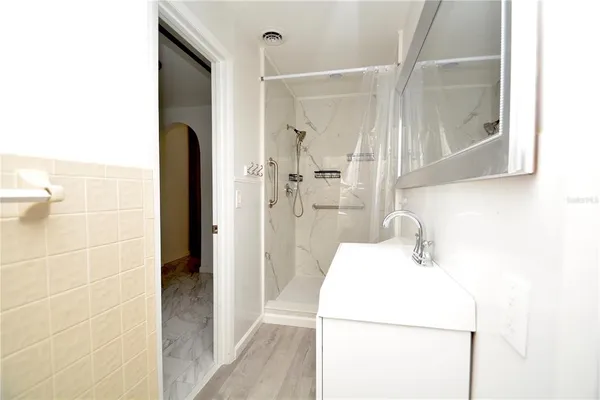 a bathroom with a sink and a shower