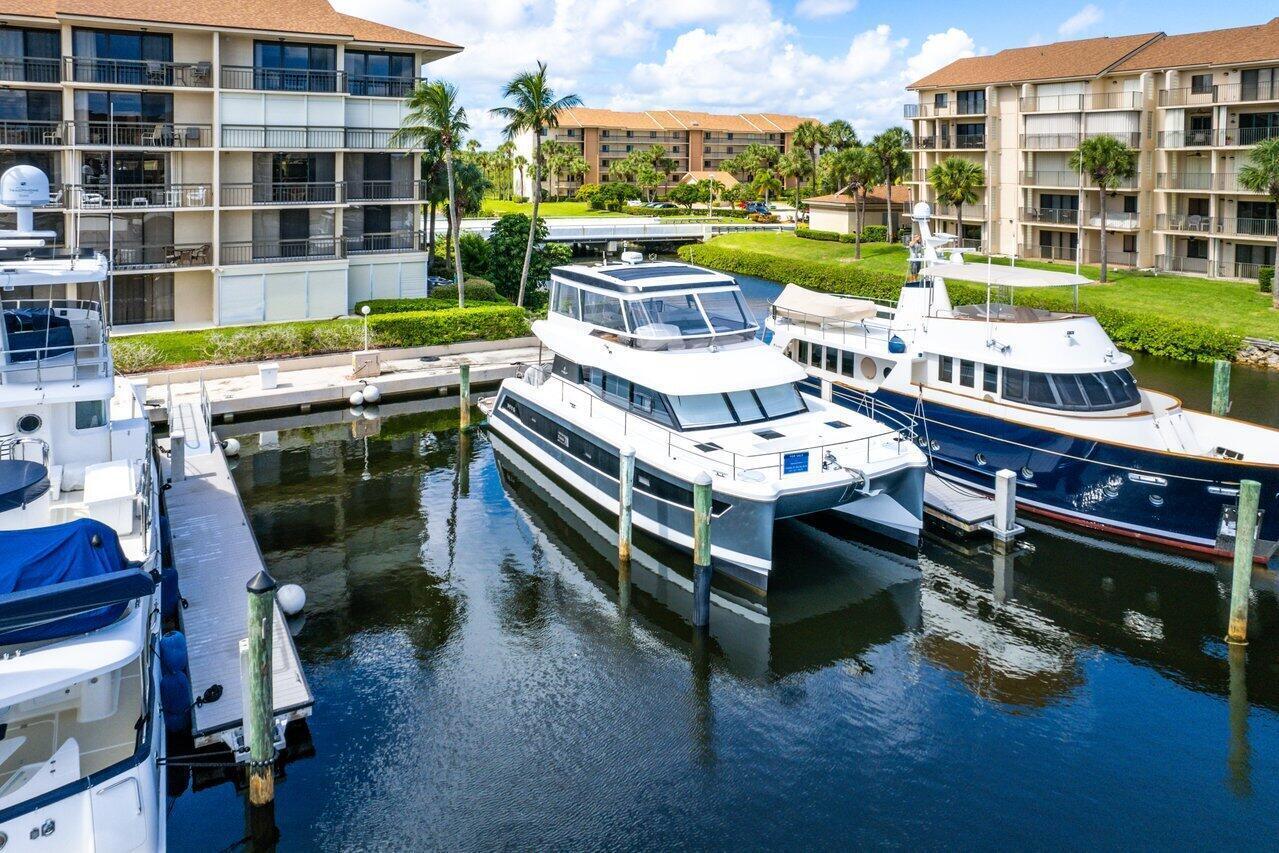 1320 Tidal Pointe Boulevard, Unit G12 Jupiter, FL 33477 - Photo 3 of 6 a view of a chairs and table in a patio