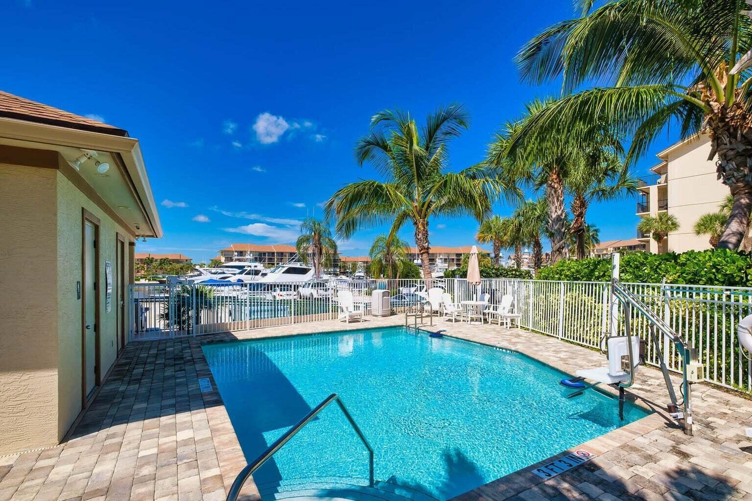 1320 Tidal Pointe Boulevard, Unit G12 Jupiter, FL 33477 - Photo 6 of 6 a view of a backyard with swimming pool
