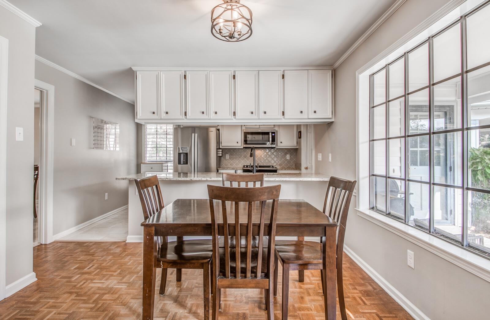 408 Avon Road Memphis, TN 38117 - Photo 12 of 25 a view of a dining room with furniture window and wooden floor