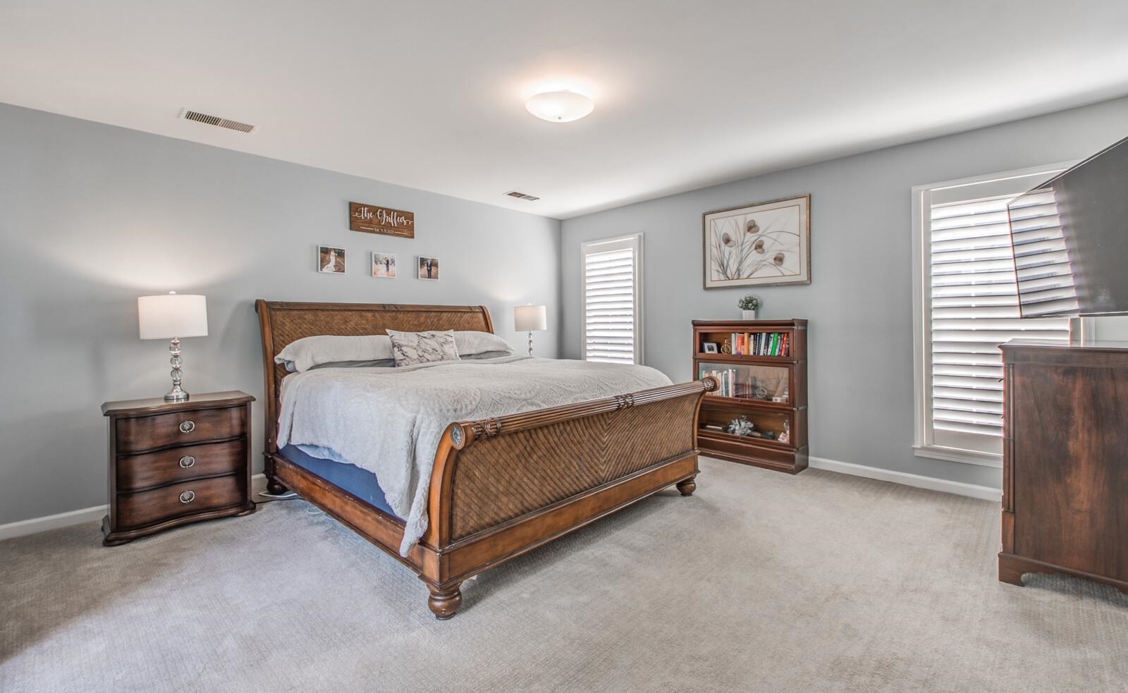 408 Avon Road Memphis, TN 38117 - Photo 14 of 25 a bedroom with a bed and a cabinets