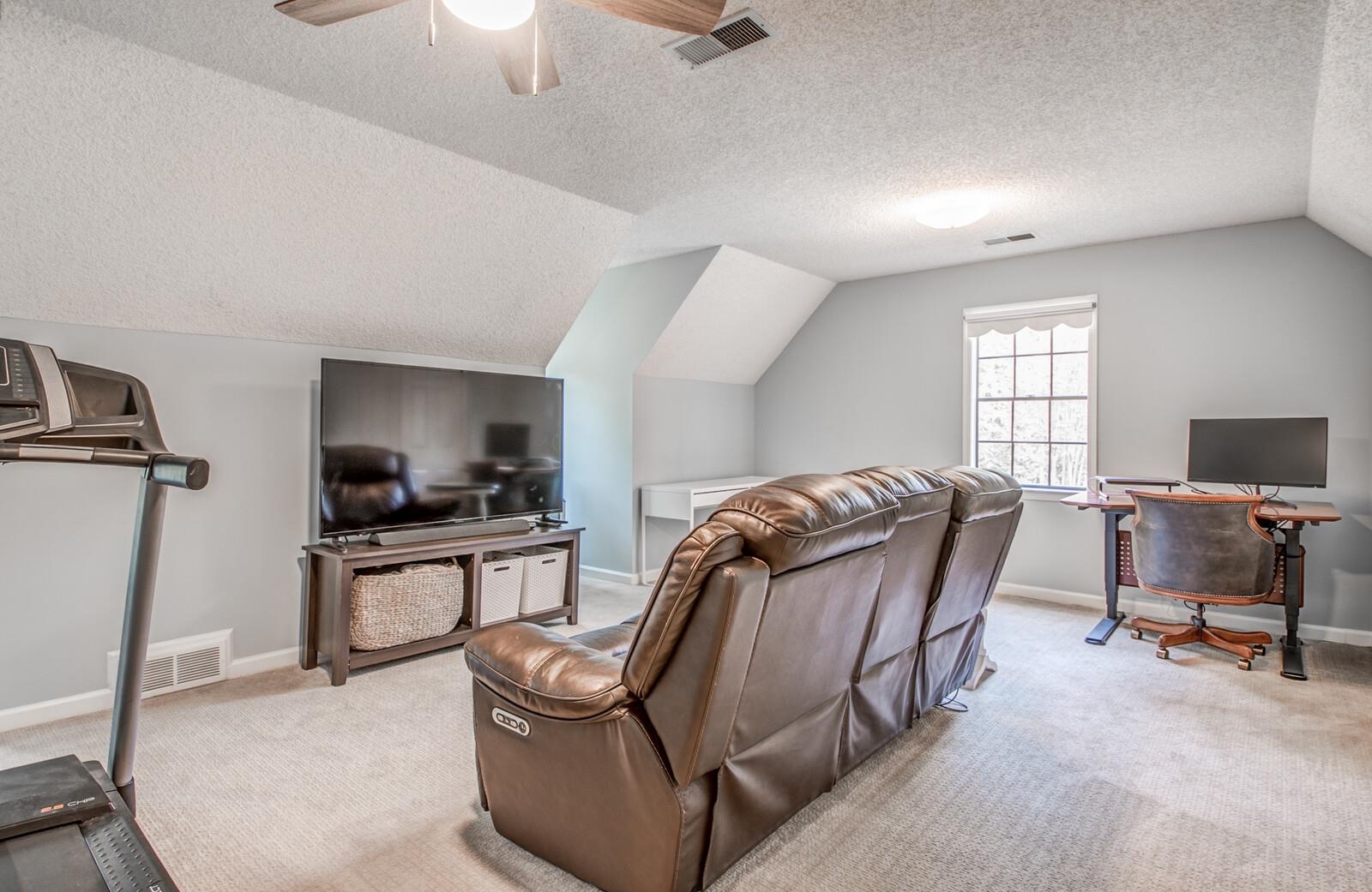408 Avon Road Memphis, TN 38117 - Photo 20 of 25 a living room with furniture window and a flat screen tv