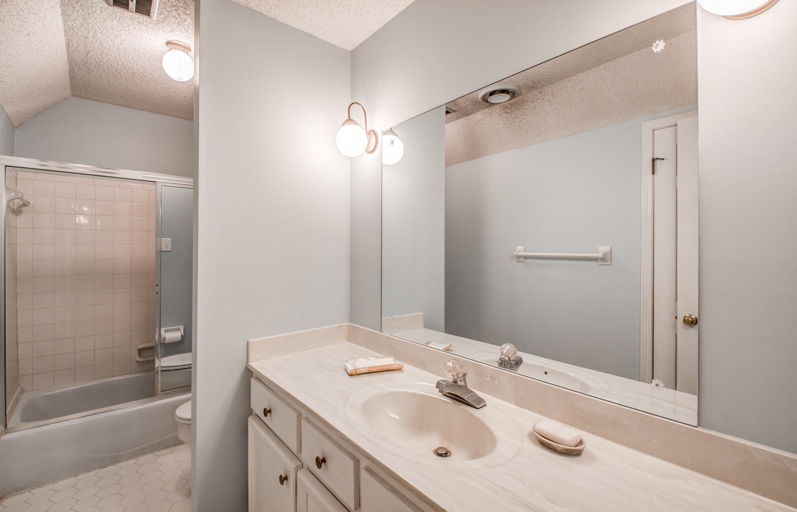 408 Avon Road Memphis, TN 38117 - Photo 21 of 25 a bathroom with a tub sink vanity granite and shower