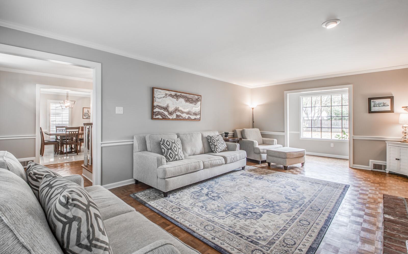 408 Avon Road Memphis, TN 38117 - Photo 6 of 25 a living room with furniture or couch and two windows