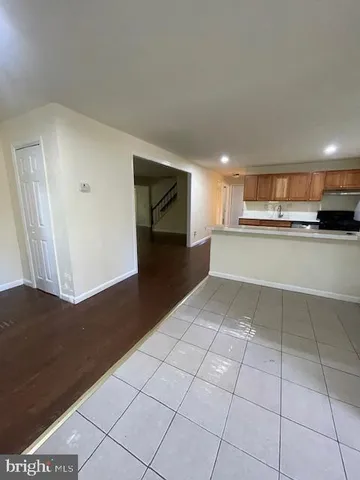 a view of a kitchen with a sink and cabinets