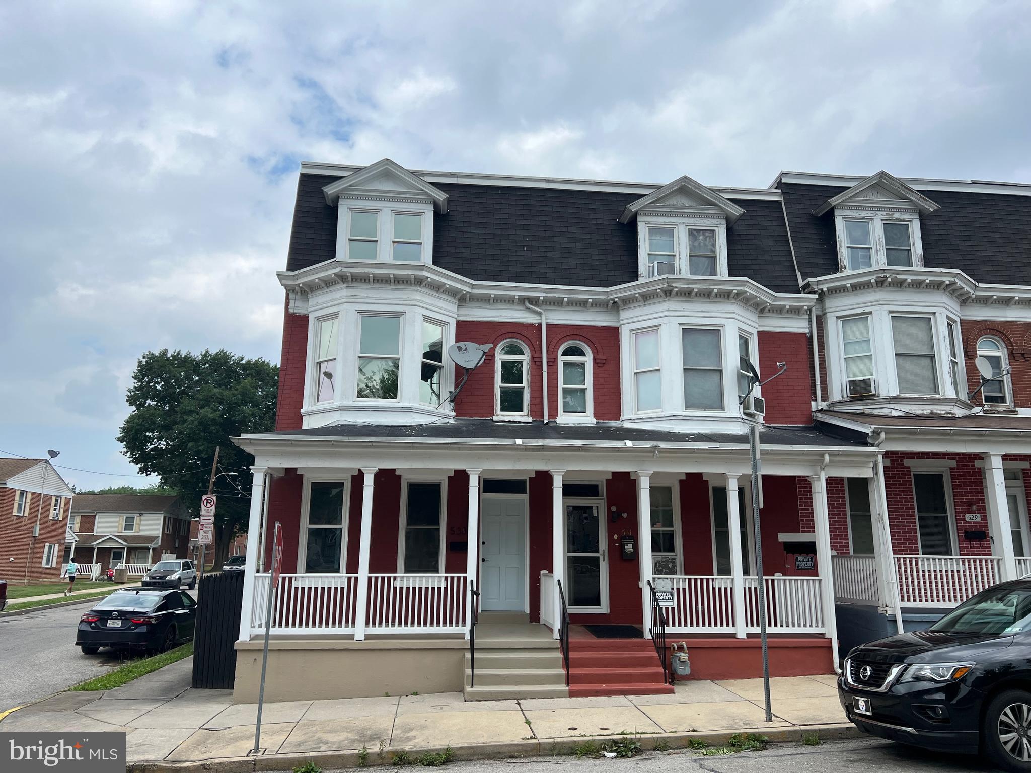 533 Thomas Street York, PA 17404 - Photo 1 of 26 a front view of a residential apartment building with a yard