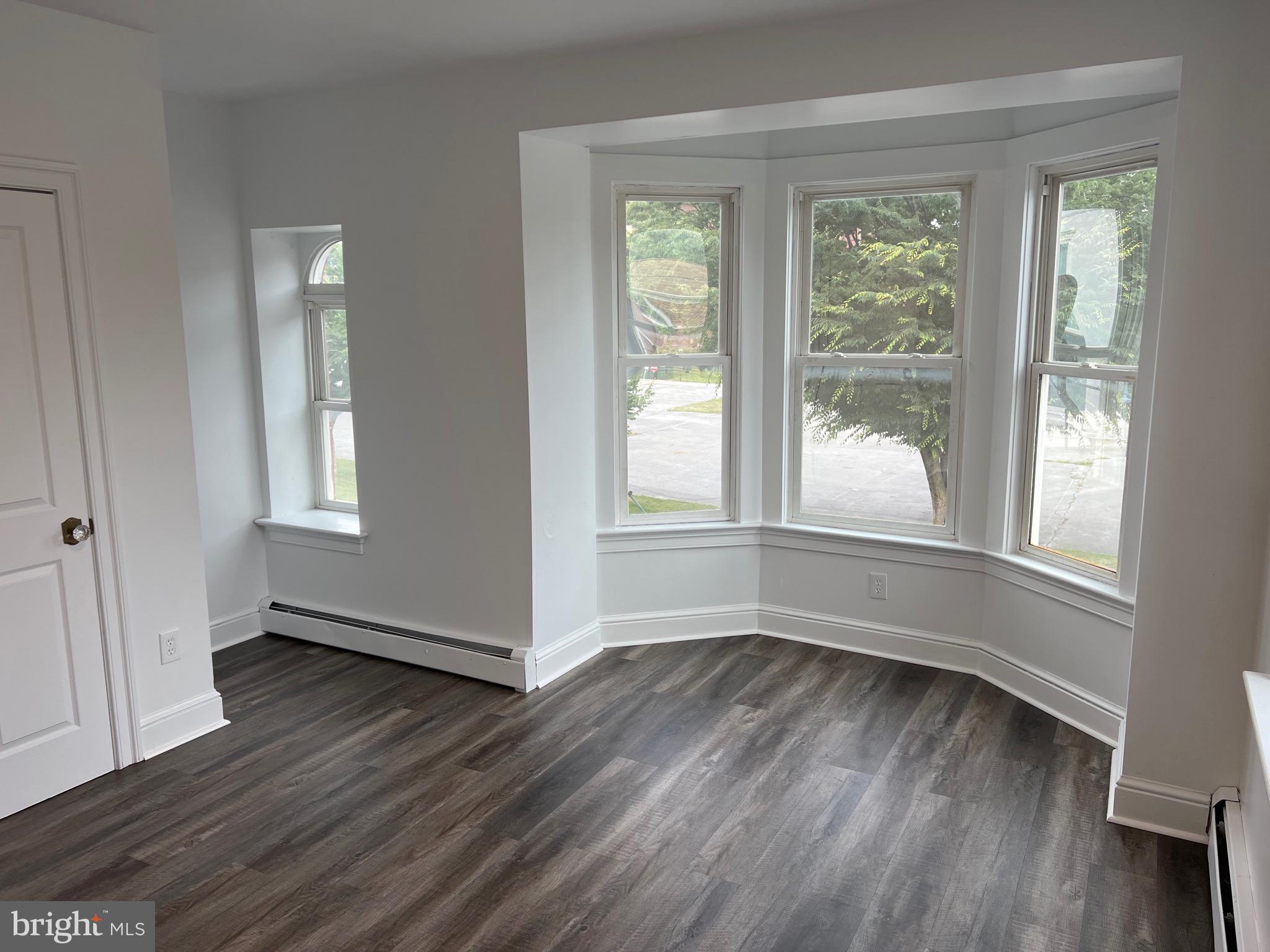 533 Thomas Street York, PA 17404 - Photo 11 of 26 a view of an empty room with wooden floor and a window