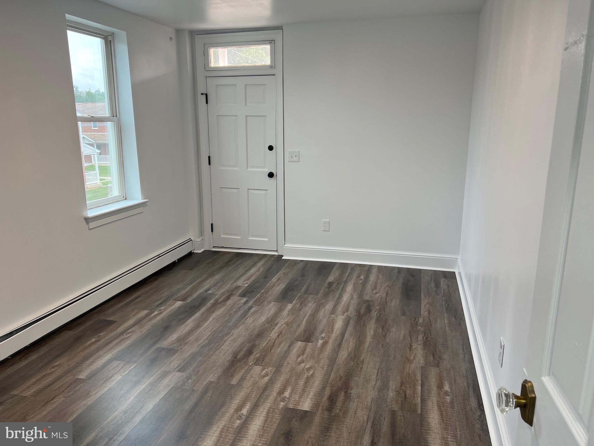 533 Thomas Street York, PA 17404 - Photo 13 of 26 wooden floor in an empty room with a window